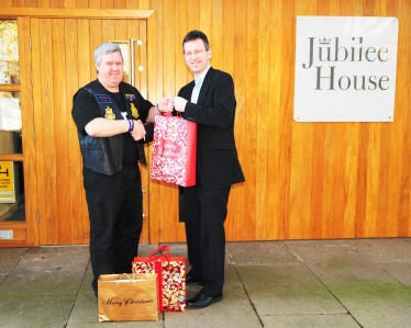 Jeremy Wright handing over donations of toiletries